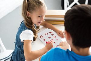 child homeschooling with whiteboard