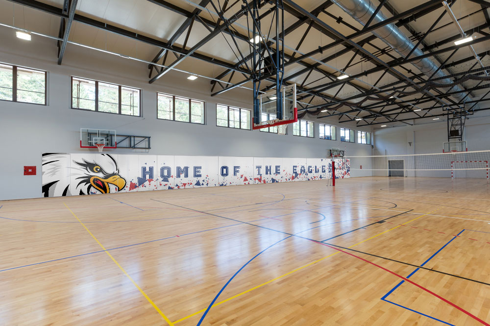custom printed full height whiteboard in a school gym
